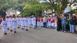 Memeriahkan  HUT ke-24 Parimo, Wabup Abdul Sahid Lepas Lomba Gerak Jalan