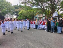 Memeriahkan  HUT ke-24 Parimo, Wabup Abdul Sahid Lepas Lomba Gerak Jalan